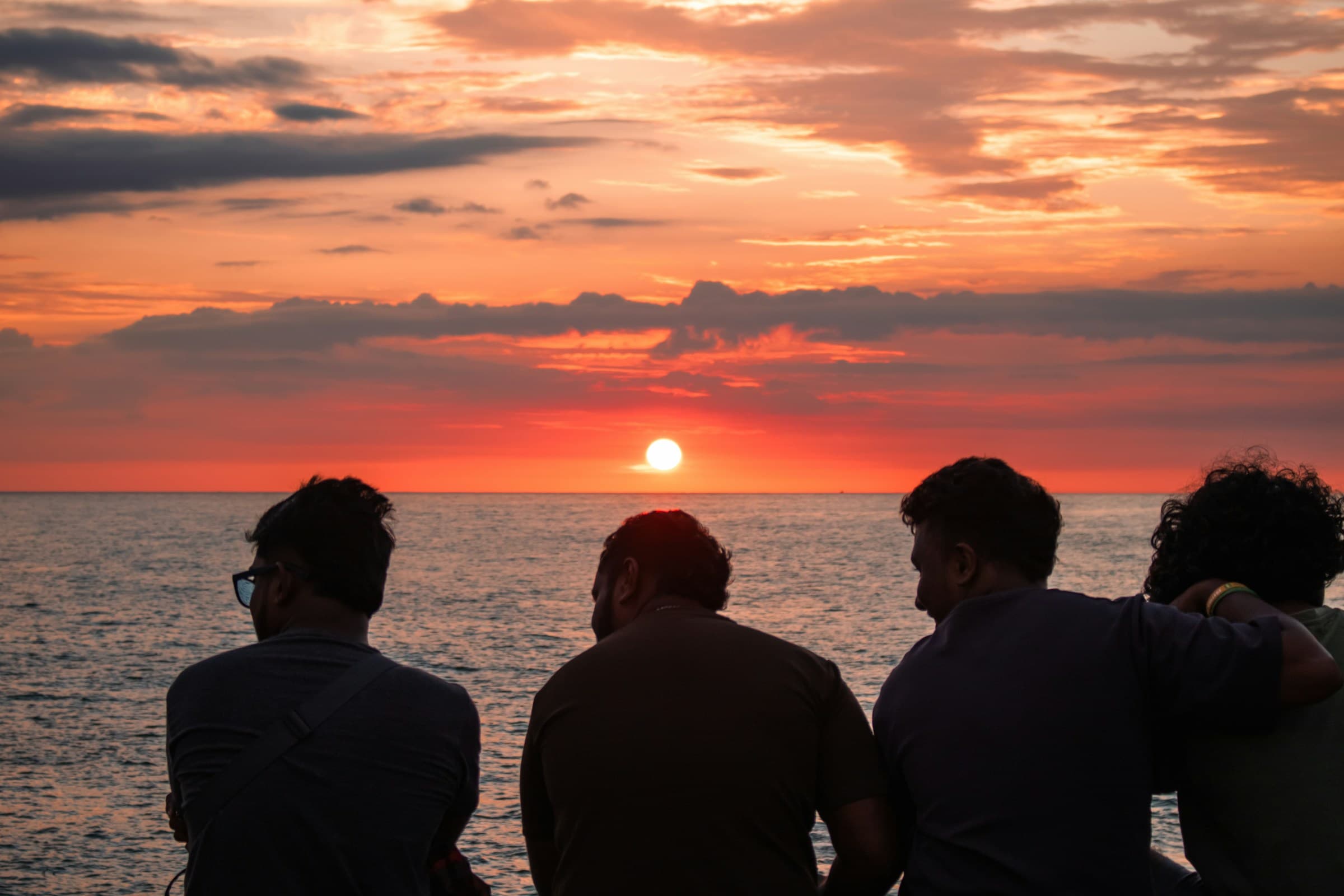 Friends watching the sunset together